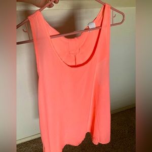 Flowy coral tank top with a bow in the back. Brand is Brenda’s, size is L
